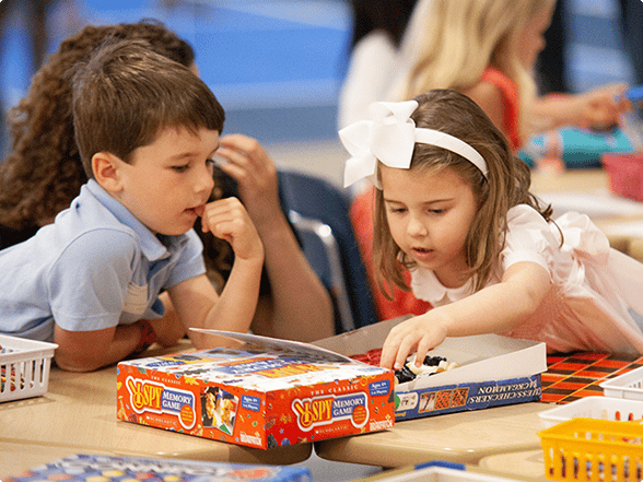Preschool children playing memory game at kids ministry in Dallas, TX.